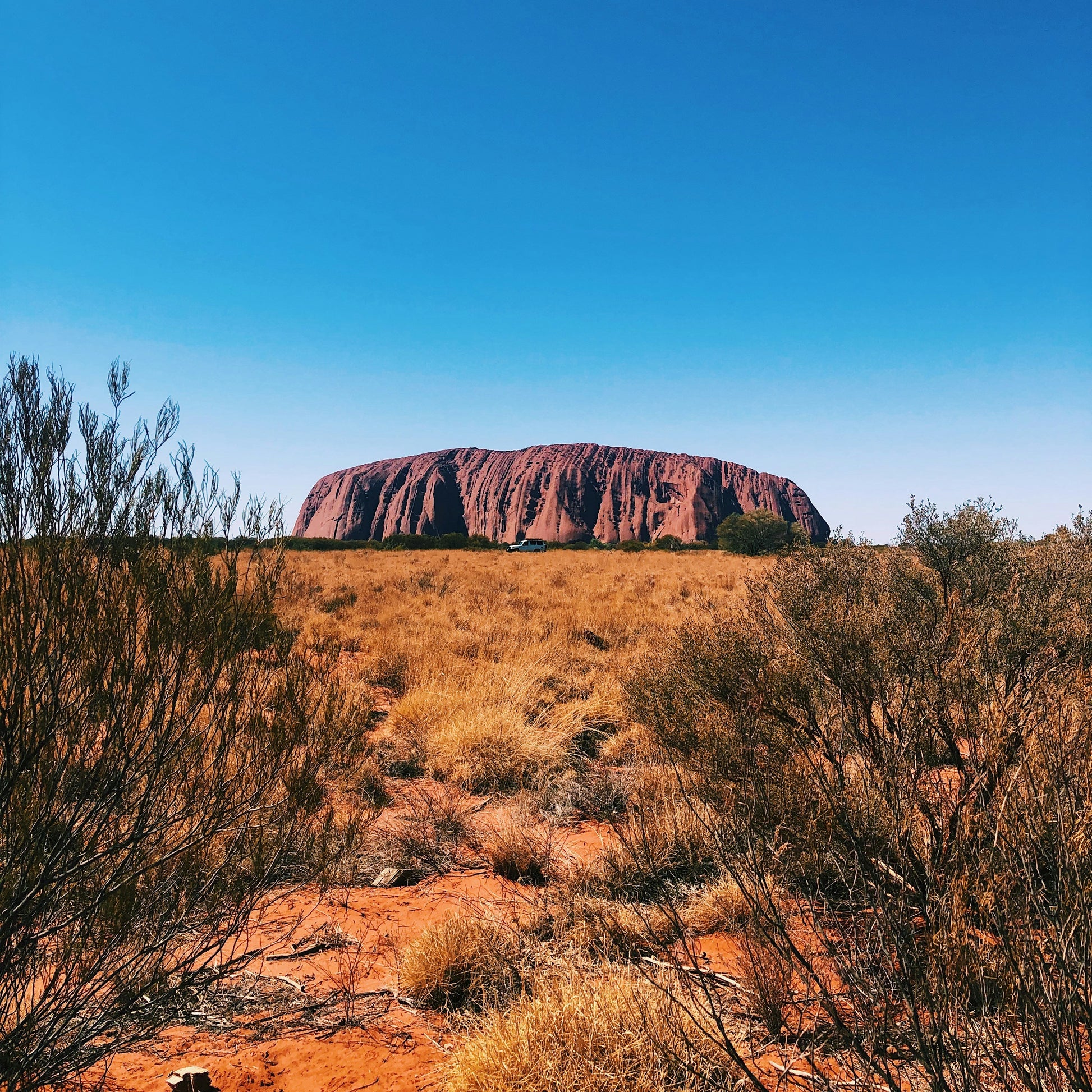  The majestic Uluru at sunset in the Outback, demonstrating nationwide connectivity and remote coverage with our Australia eSIM.